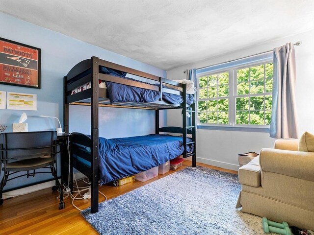 84 Lancaster Rd Unit 84, Dedham, MA 02026 - bedroom featuring baseboards and wood finished floors