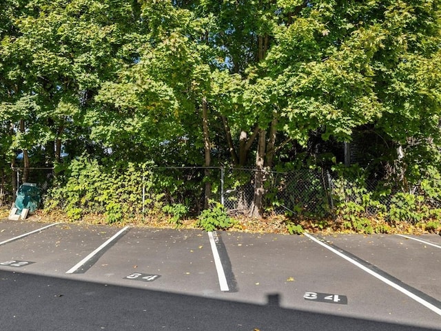 84 Lancaster Rd Unit 84, Dedham, MA 02026 - uncovered parking lot with fence
