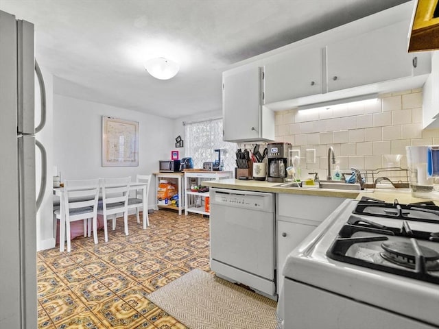 84 Lancaster Rd Unit 84, Dedham, MA 02026 - kitchen featuring white appliances, white cabinetry, light countertops, a sink, and backsplash