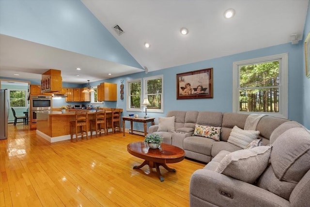 290 Mendell Rd, Rochester, MA 02770 - living room with light wood-style flooring, plenty of natural light, and high vaulted ceiling