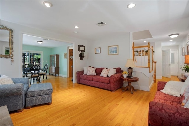 290 Mendell Rd, Rochester, MA 02770 - living room featuring light wood-style floors, stairs, and recessed lighting