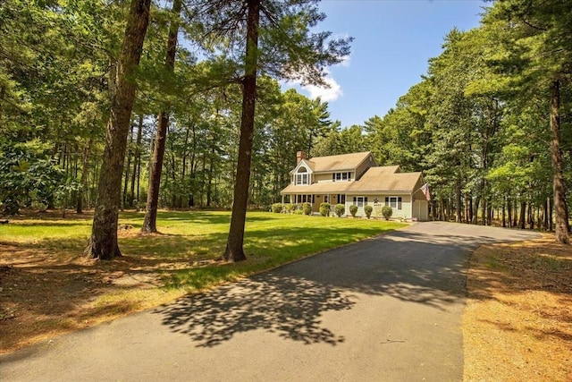 290 Mendell Rd, Rochester, MA 02770 - view of front of house featuring a front lawn, driveway, a chimney, and a view of trees