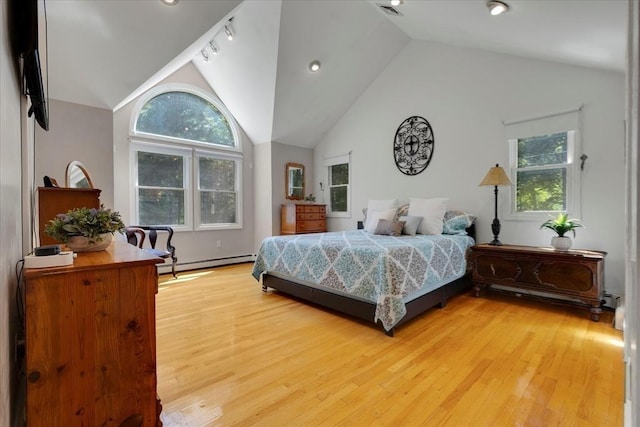 290 Mendell Rd, Rochester, MA 02770 - bedroom with a baseboard heating unit, multiple windows, light wood finished floors, and high vaulted ceiling