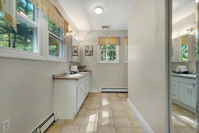 290 Mendell Rd, Rochester, MA 02770 - bathroom featuring a baseboard radiator, vanity, and tile patterned flooring