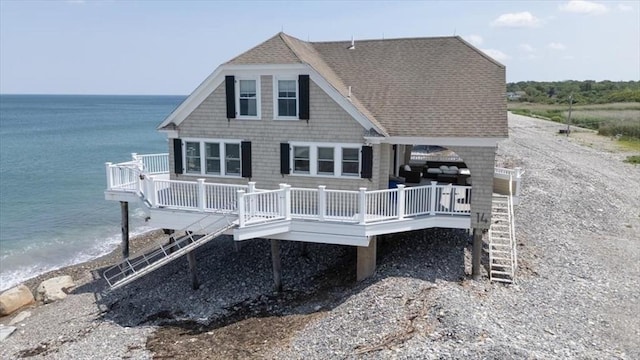 14 Stanton Ln, Scituate, MA 02066 - back of property with a shingled roof and a deck with water view