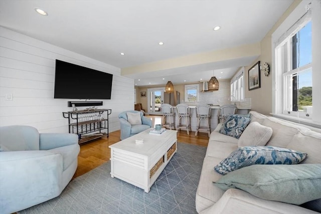 14 Stanton Ln, Scituate, MA 02066 - living room featuring plenty of natural light, wood finished floors, recessed lighting, and wood walls