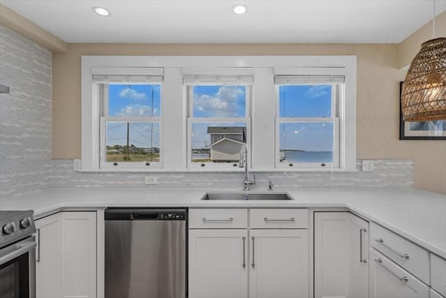 14 Stanton Ln, Scituate, MA 02066 - kitchen featuring stainless steel appliances, white cabinets, light countertops, and recessed lighting