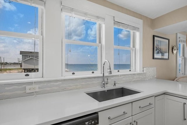 14 Stanton Ln, Scituate, MA 02066 - kitchen featuring light countertops, tasteful backsplash, and white cabinetry