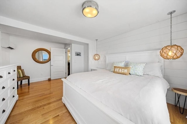 14 Stanton Ln, Scituate, MA 02066 - bedroom featuring an AC wall unit and light wood finished floors