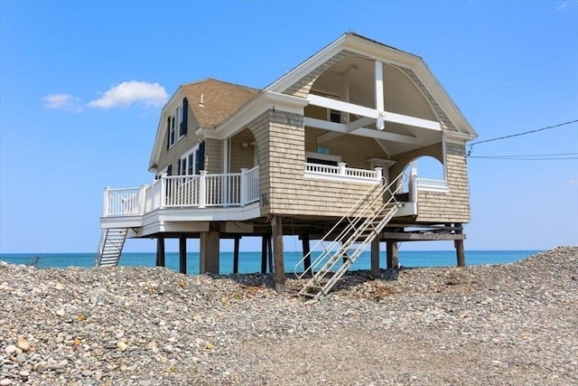 14 Stanton Ln, Scituate, MA 02066 - view of front of home with a water view, stairway, a porch, and cooling unit