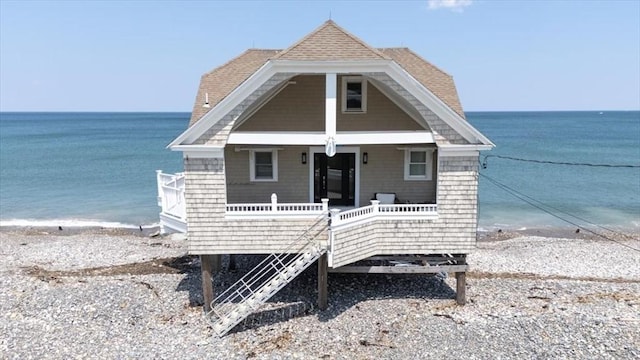 14 Stanton Ln, Scituate, MA 02066 - view of front facade with view of water and beach and a porch