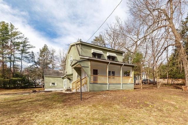 back of house with a porch
