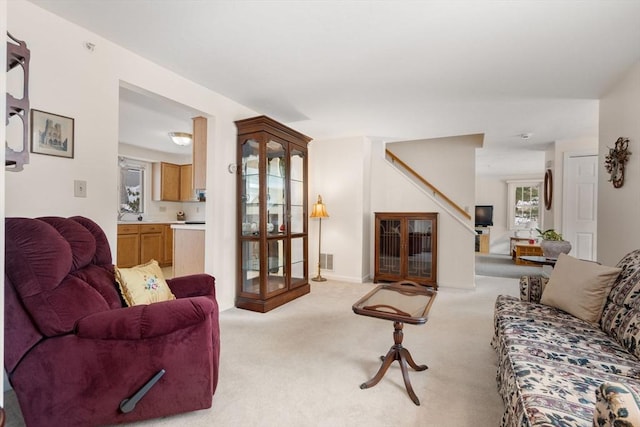 living room featuring light colored carpet