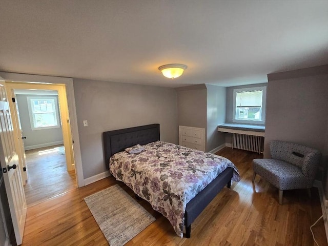 3 S Ter, Auburn, MA 01501 - bedroom with radiator heating unit, wood finished floors, and multiple windows