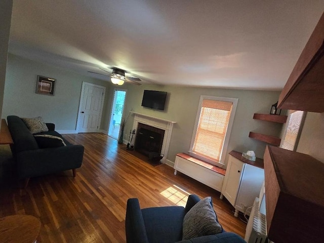 3 S Ter, Auburn, MA 01501 - living area featuring healthy amount of natural light, wood finished floors, a fireplace with flush hearth, and a ceiling fan