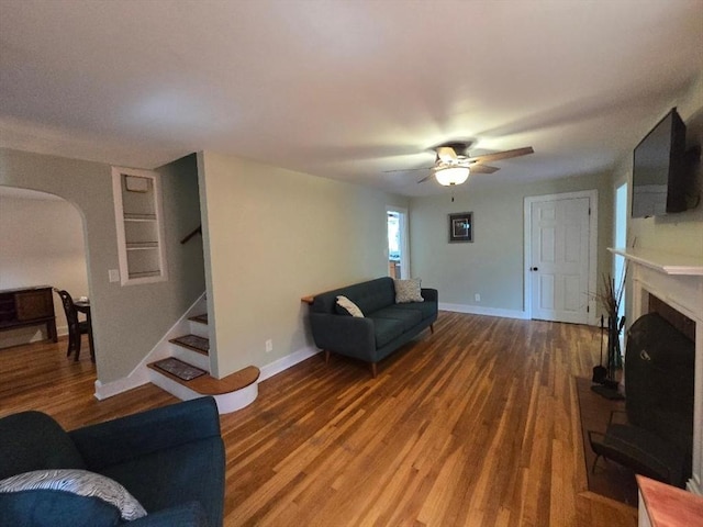3 S Ter, Auburn, MA 01501 - living room featuring arched walkways, stairs, wood finished floors, and a ceiling fan