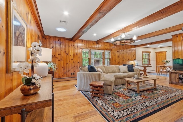 6 N St, Acton, MA 01720 - living room with baseboard heating, beam ceiling, light wood-style flooring, wooden walls, and recessed lighting