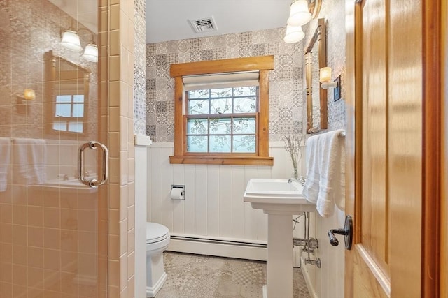 6 N St, Acton, MA 01720 - bathroom featuring a baseboard radiator, toilet, a shower stall, and a wainscoted wall