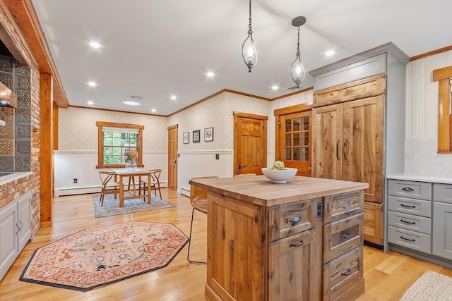 6 N St, Acton, MA 01720 - kitchen with ornamental molding, wood counters, light wood finished floors, wainscoting, and gray cabinets