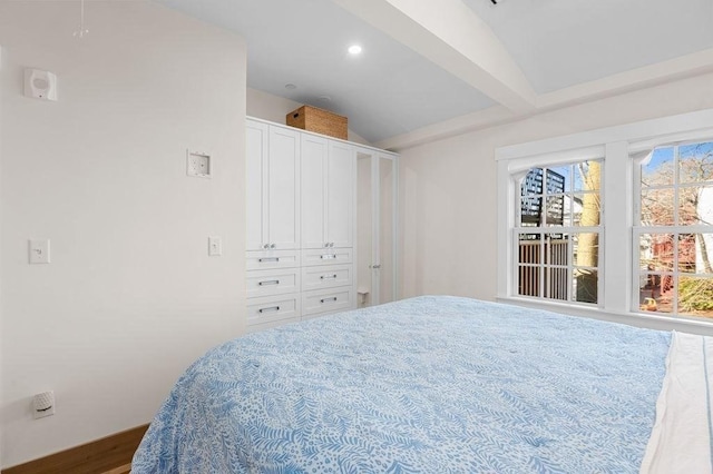 bedroom with vaulted ceiling with beams and recessed lighting