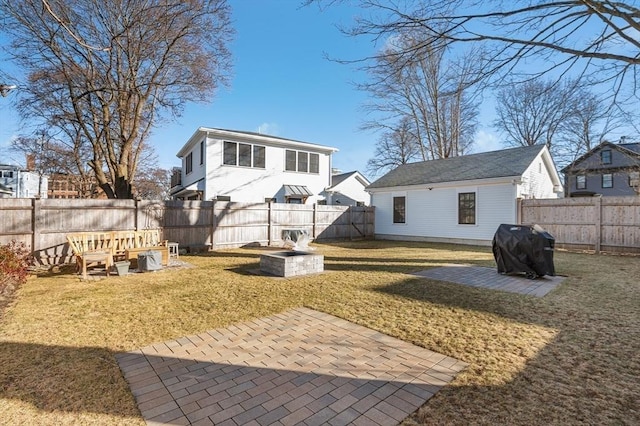 back of house with a patio, a yard, and a fenced backyard