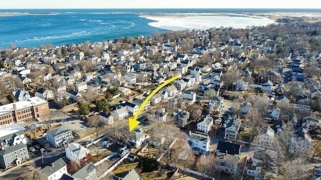 drone / aerial view featuring a water view and a residential view