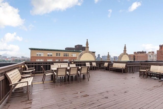 4 Charlesgate E Unit 106, Boston, MA 02215 - deck with outdoor dining area and a city view