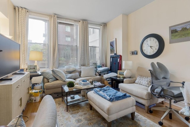 4 Charlesgate E Unit 106, Boston, MA 02215 - living room featuring light wood finished floors and plenty of natural light
