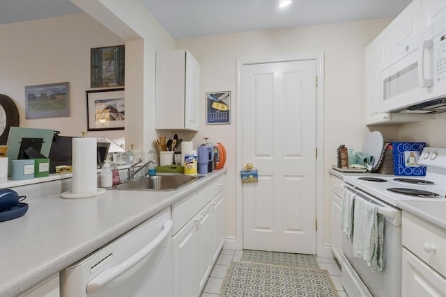 4 Charlesgate E Unit 106, Boston, MA 02215 - kitchen featuring white appliances, white cabinets, light countertops, and light tile patterned floors