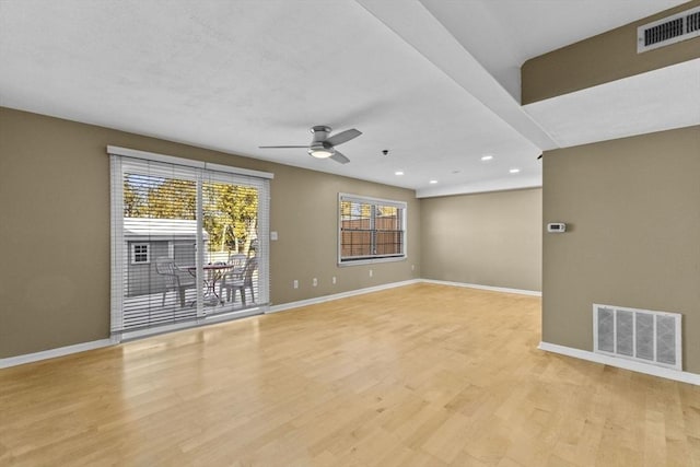 unfurnished room with ceiling fan and light wood-type flooring