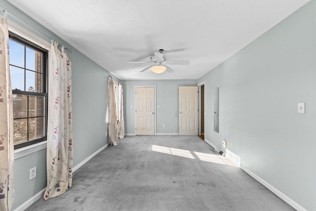 unfurnished room featuring ceiling fan and light carpet