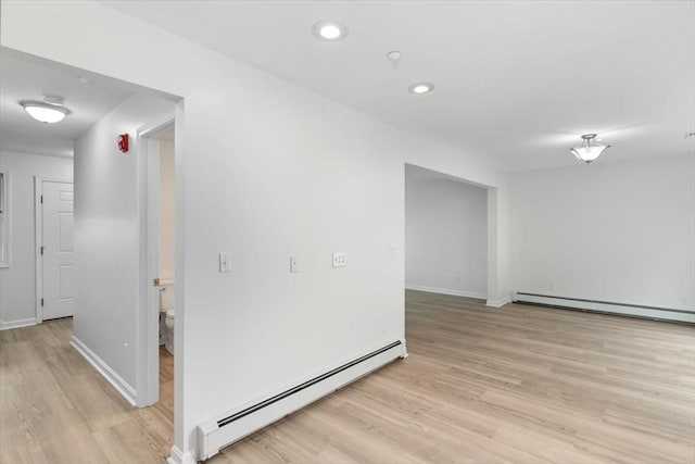38 Abbey Rd Unit 38, Brentwood, NH 03833 - unfurnished room with a baseboard heating unit, a baseboard radiator, light wood-style floors, and recessed lighting