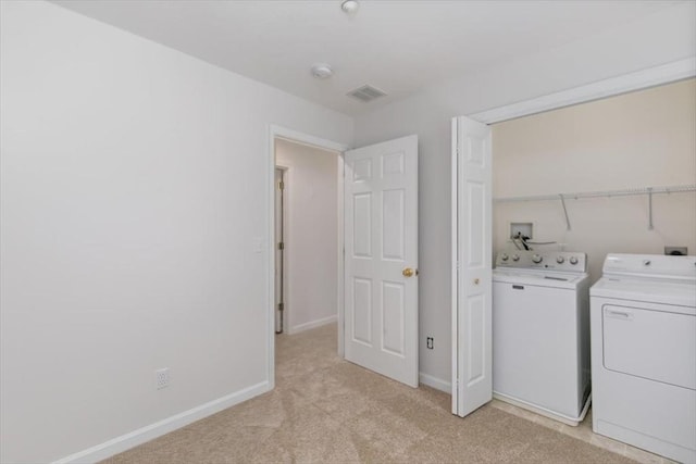 38 Abbey Rd Unit 38, Brentwood, NH 03833 - laundry area with washing machine and clothes dryer and light colored carpet
