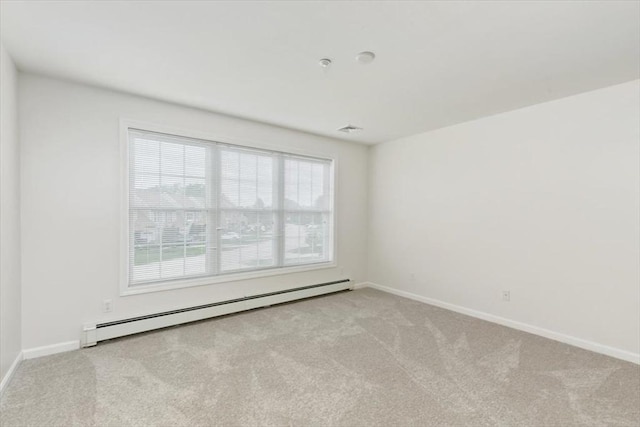 38 Abbey Rd Unit 38, Brentwood, NH 03833 - spare room featuring a baseboard heating unit and carpet floors