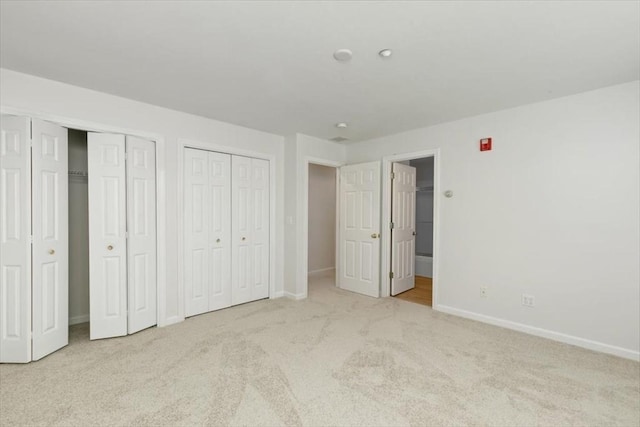 38 Abbey Rd Unit 38, Brentwood, NH 03833 - unfurnished bedroom featuring carpet flooring and multiple closets