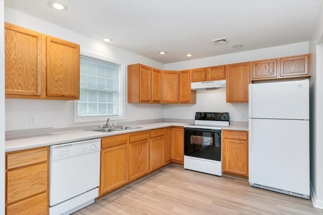38 Abbey Rd Unit 38, Brentwood, NH 03833 - kitchen with white appliances, under cabinet range hood, light countertops, light wood finished floors, and recessed lighting