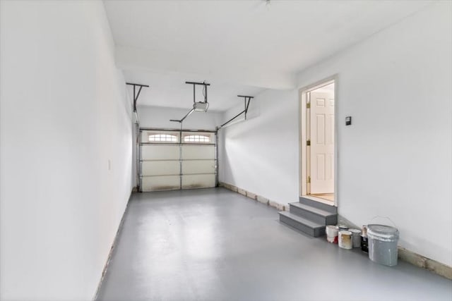 38 Abbey Rd Unit 38, Brentwood, NH 03833 - garage with a garage door opener and baseboards