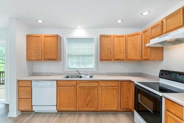 38 Abbey Rd Unit 38, Brentwood, NH 03833 - kitchen featuring range with electric cooktop, dishwasher, under cabinet range hood, light wood-type flooring, and light countertops