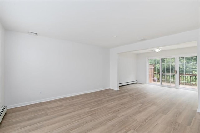 38 Abbey Rd Unit 38, Brentwood, NH 03833 - spare room featuring a baseboard heating unit and light wood-style floors