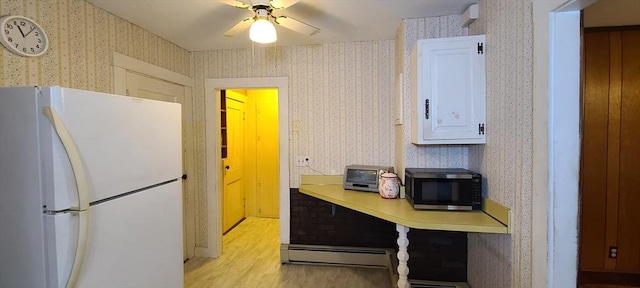 293 Cocasset St, Foxboro, MA 02035 - kitchen featuring freestanding refrigerator, black microwave, light wood finished floors, wallpapered walls, and light countertops