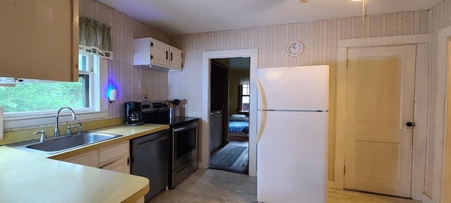 293 Cocasset St, Foxboro, MA 02035 - kitchen featuring freestanding refrigerator, dishwasher, electric stove, wallpapered walls, and light countertops