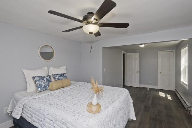 bedroom featuring baseboards, a ceiling fan, dark wood-style flooring, and baseboard heating