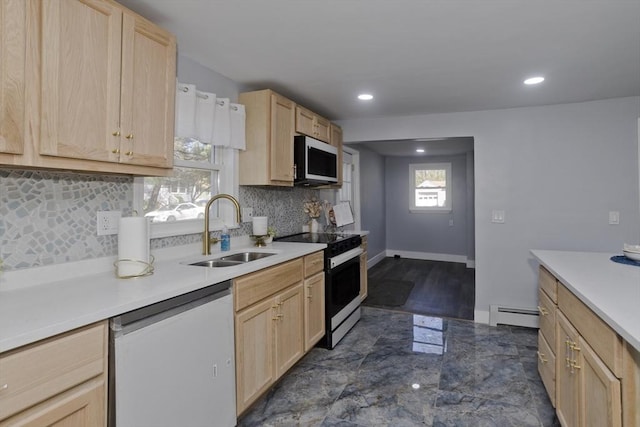 kitchen featuring light brown cabinets, range with electric stovetop, a baseboard heating unit, a sink, and dishwasher