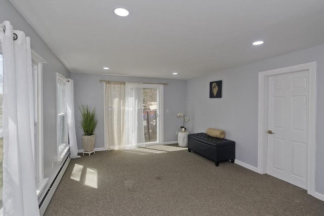 sitting room with carpet floors, baseboards, a baseboard heating unit, and recessed lighting