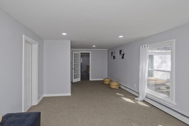 carpeted spare room featuring recessed lighting and baseboards