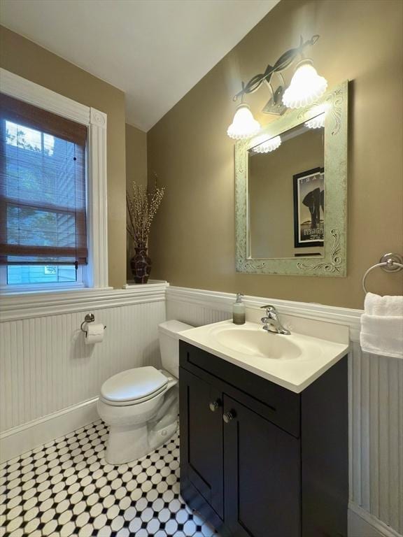 36-1/2 Pearl St Unit 36H, Milford, MA 01757 - bathroom with a wainscoted wall, vanity, tile patterned flooring, and vaulted ceiling
