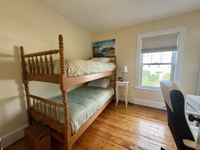 36-1/2 Pearl St Unit 36H, Milford, MA 01757 - bedroom with hardwood / wood-style flooring and a baseboard heating unit