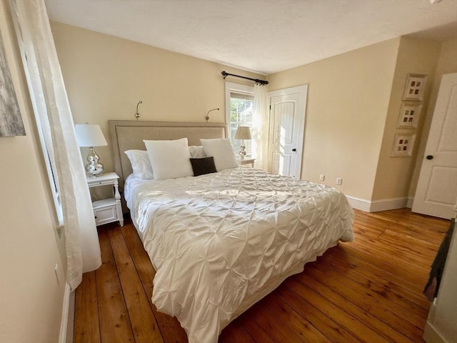 36-1/2 Pearl St Unit 36H, Milford, MA 01757 - bedroom with hardwood / wood-style flooring and baseboards