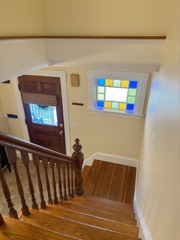 36-1/2 Pearl St Unit 36H, Milford, MA 01757 - stairway with wood finished floors and baseboards