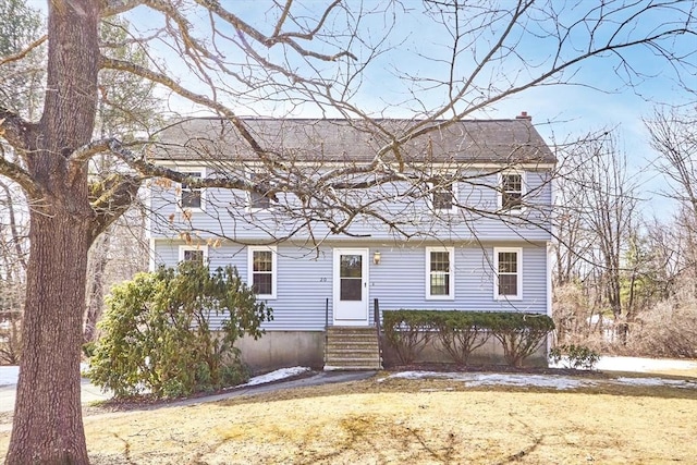 colonial inspired home with entry steps